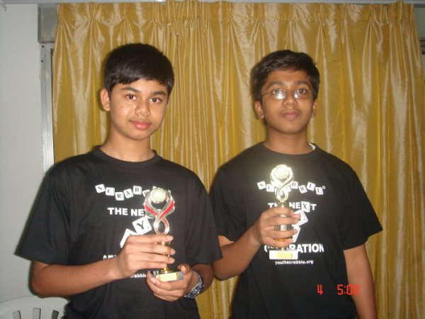 varun and jacob receiving trophies